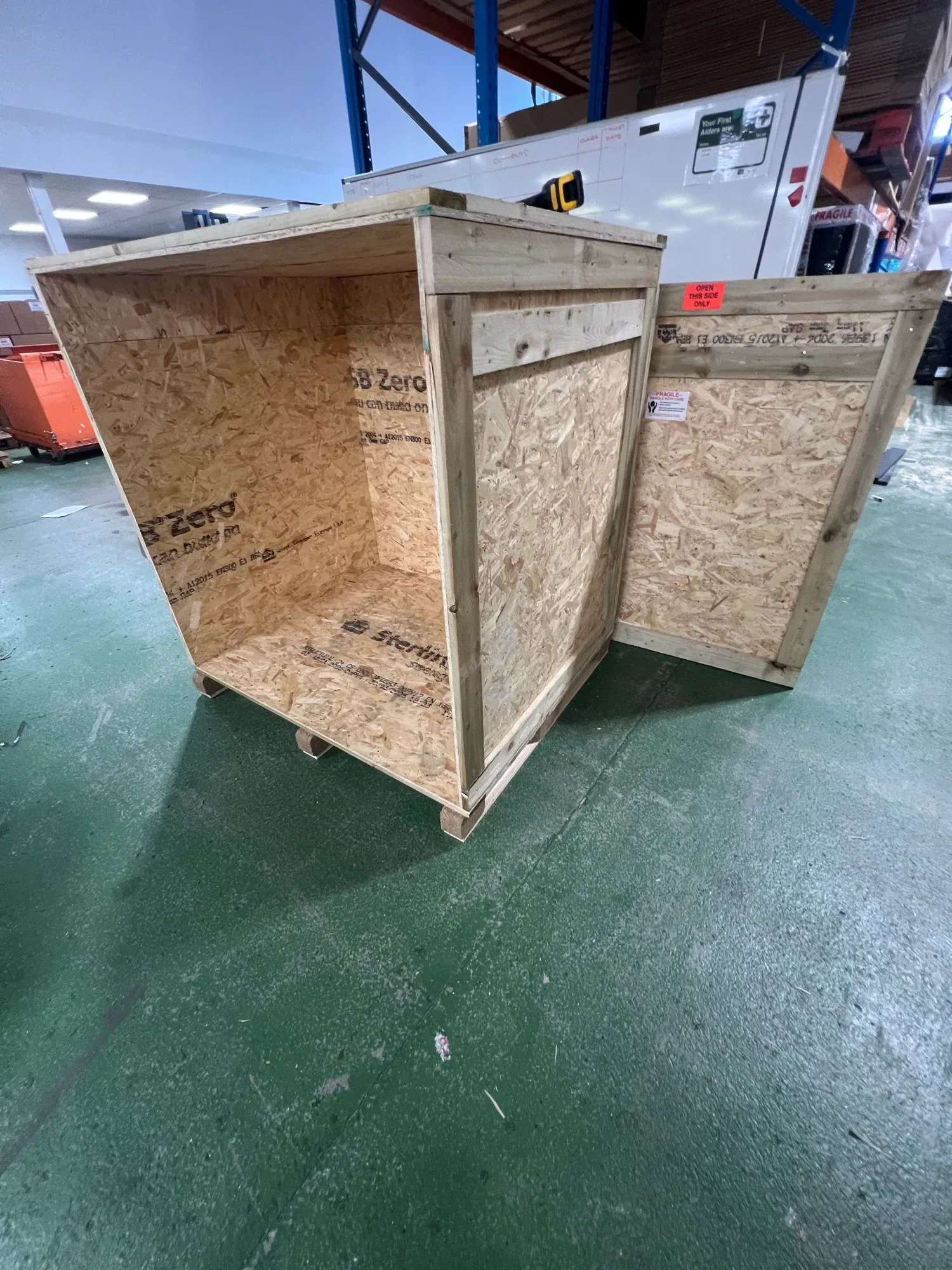 Open export crate built from OSB and timber in the Ultimat workshop, ready to load